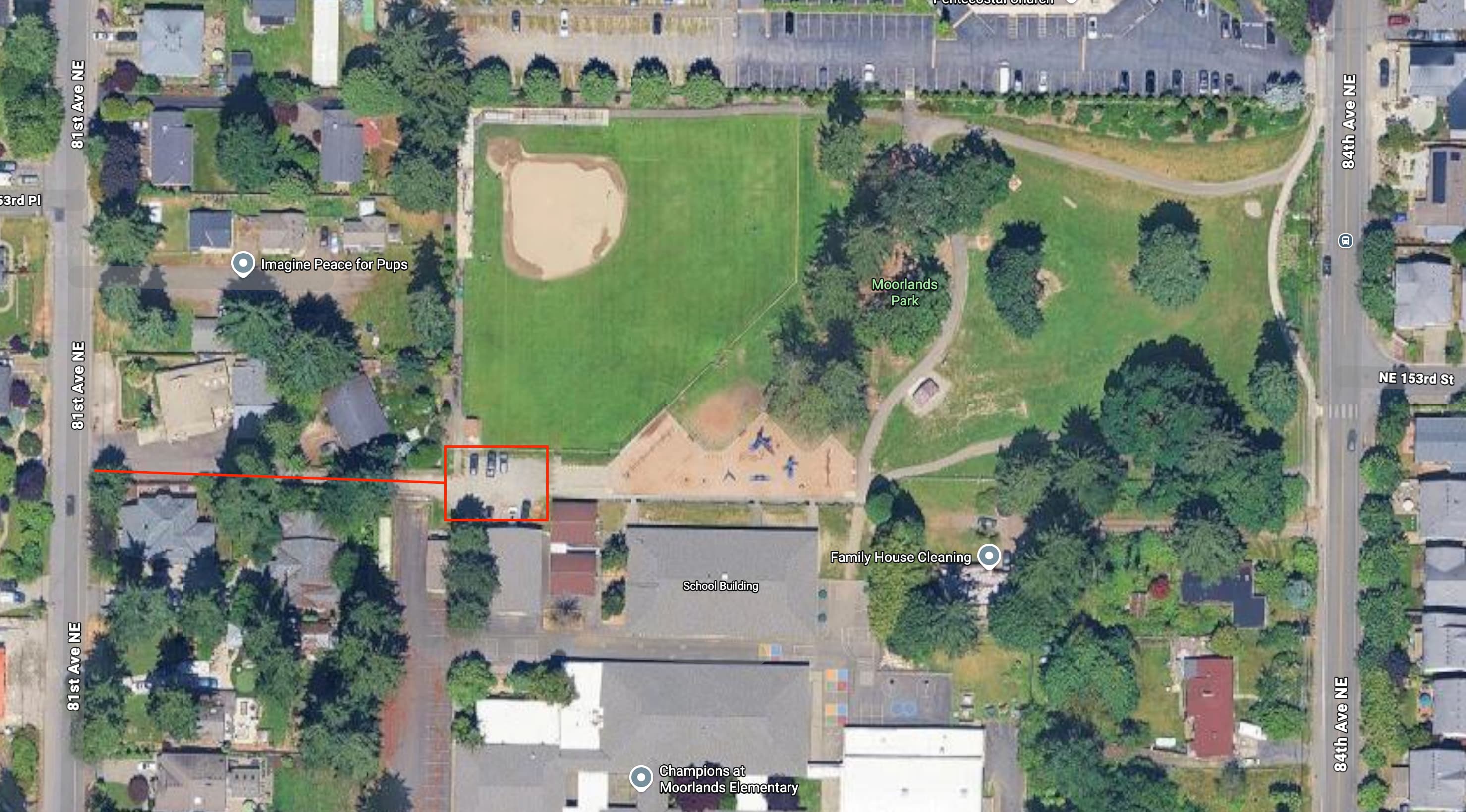 Aerial view of Moorlands Elementary with the back parking lot by the playground highlighted by a red rectangle